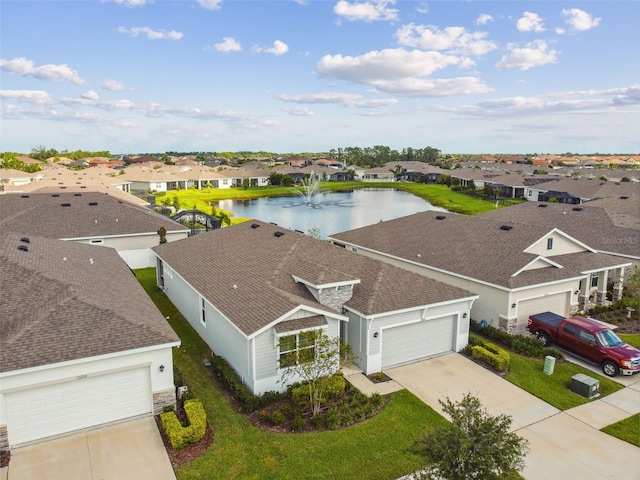 bird's eye view with a water view