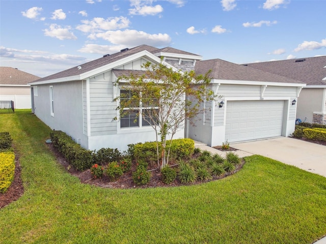 single story home featuring a front yard and a garage