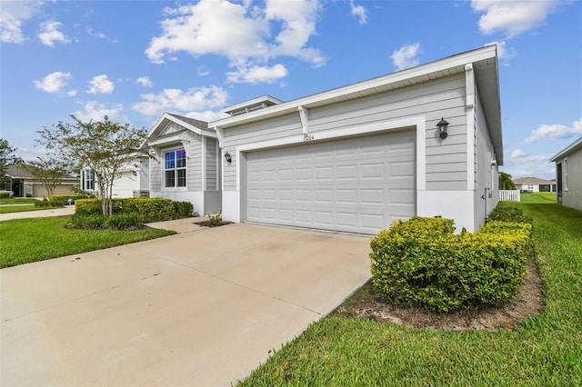 view of front of house with a front lawn and a garage