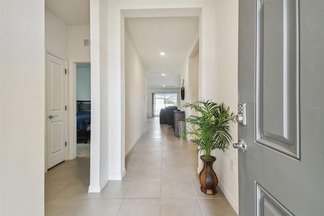 foyer entrance with light tile patterned flooring