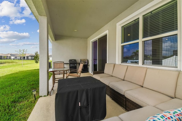 view of patio / terrace with area for grilling and outdoor lounge area