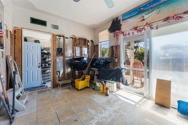 14180 W Parsley Dr, Madeira Beach, FL 33708 - interior space featuring visible vents and a ceiling fan