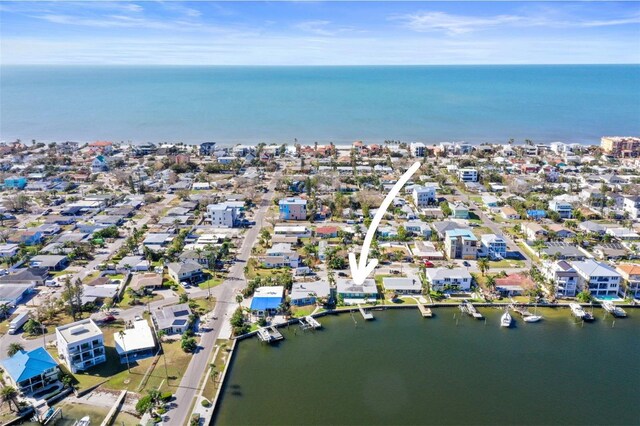 drone / aerial view with a water view and a residential view