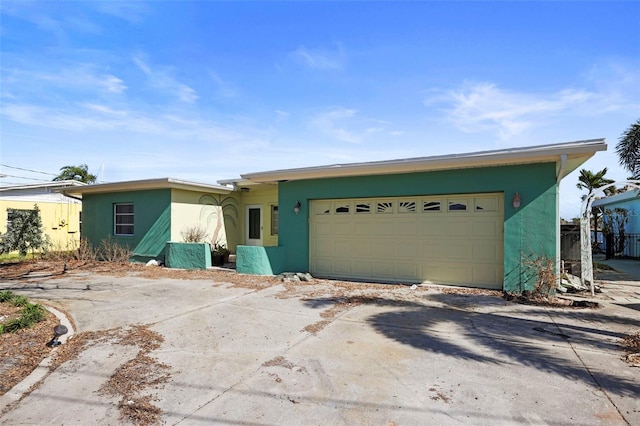 single story home with a garage