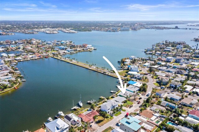 drone / aerial view with a residential view and a water view