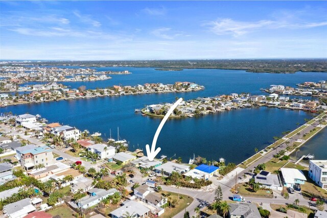 birds eye view of property with a residential view and a water view