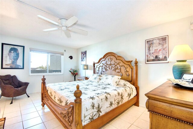 bedroom featuring light tile patterned flooring and a ceiling fan