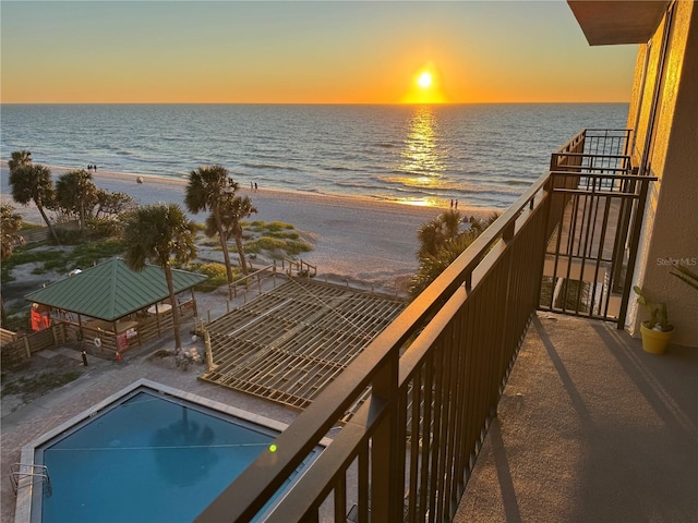 balcony with a view of the beach and a water view