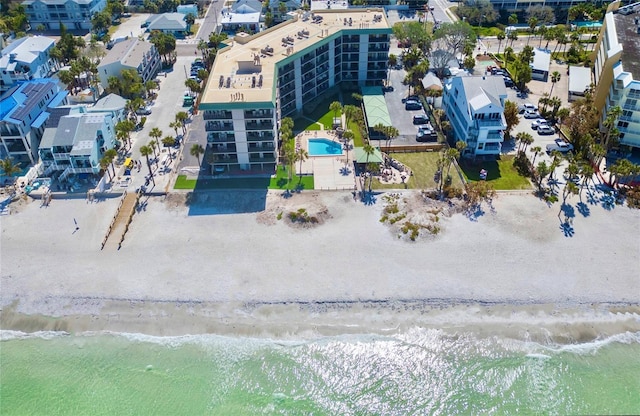 drone / aerial view of unending shoreline and apartment complex