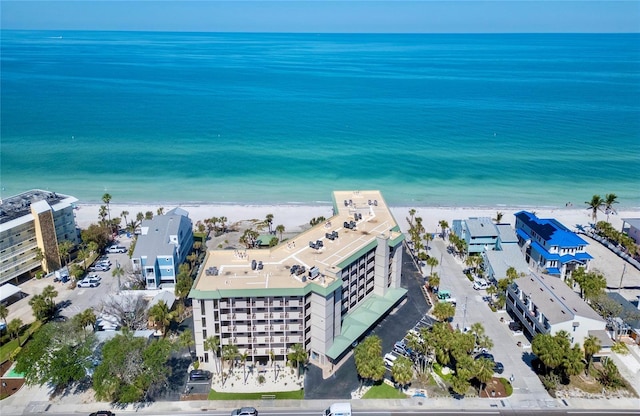 drone / aerial view of extended coastline and apartment complex / building