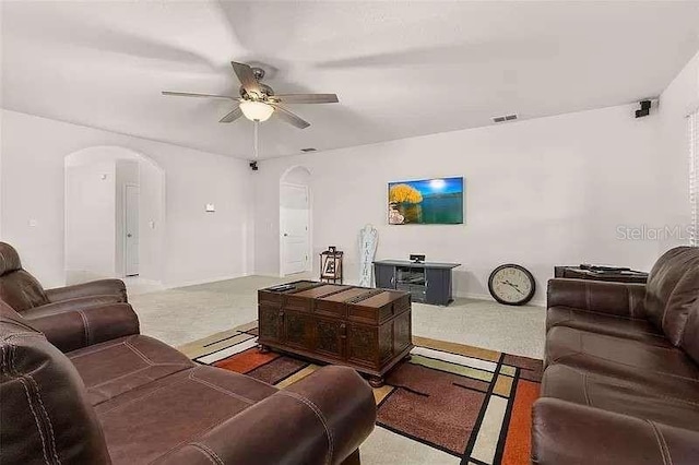 living room with carpet and ceiling fan