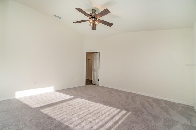 carpeted empty room featuring lofted ceiling and ceiling fan