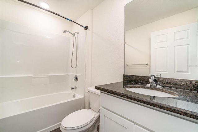 full bathroom with vanity, shower / tub combination, and toilet