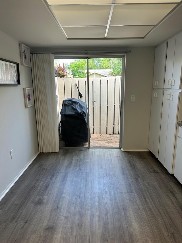 unfurnished room featuring dark hardwood / wood-style flooring