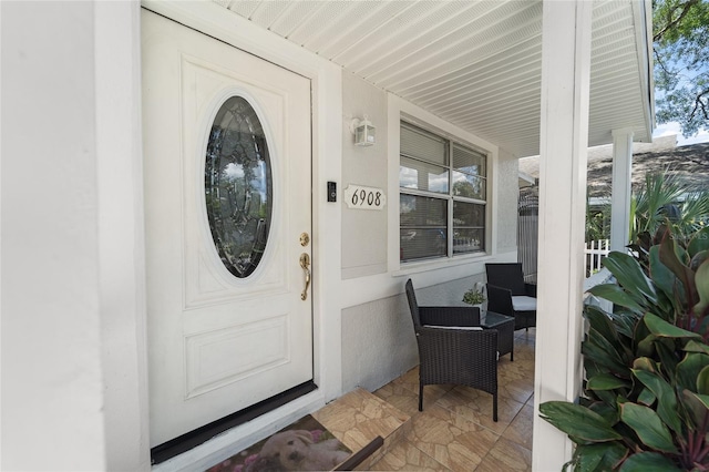 doorway to property with covered porch