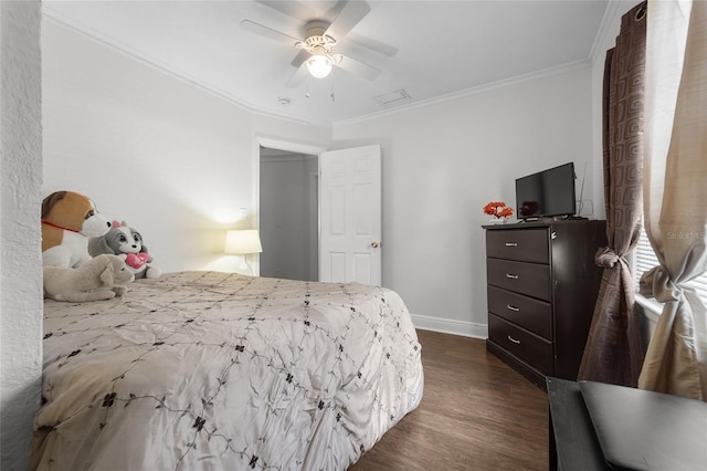 bedroom with dark hardwood / wood-style flooring, crown molding, and ceiling fan