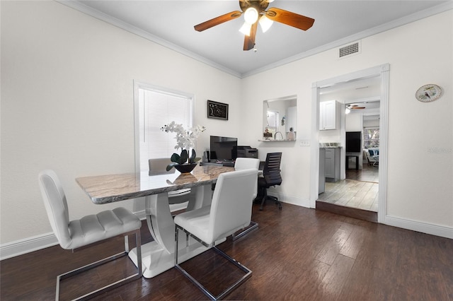 dining space featuring crown molding, ceiling fan, and dark hardwood / wood-style flooring