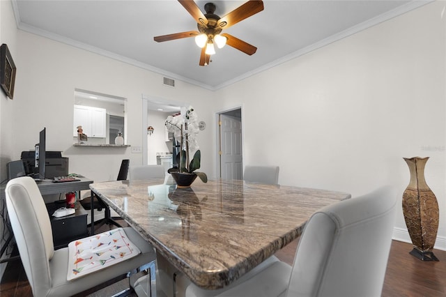 dining area featuring ceiling fan, ornamental molding, and dark hardwood / wood-style floors