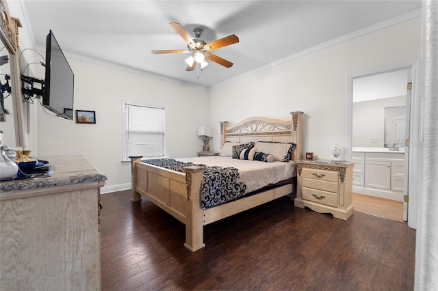 bedroom featuring ornamental molding, dark hardwood / wood-style floors, ensuite bathroom, and ceiling fan