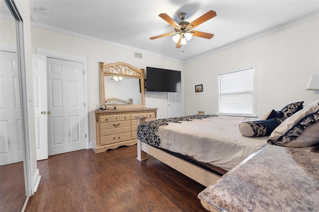 bedroom featuring ornamental molding, dark wood-type flooring, and ceiling fan