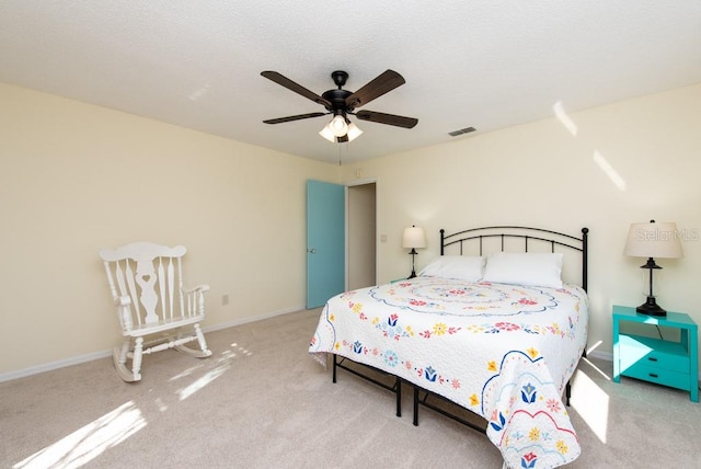 bedroom with light colored carpet and ceiling fan