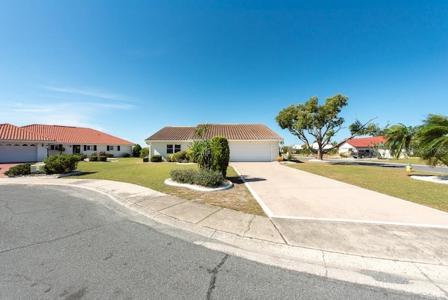 view of front of house featuring a front yard and a garage