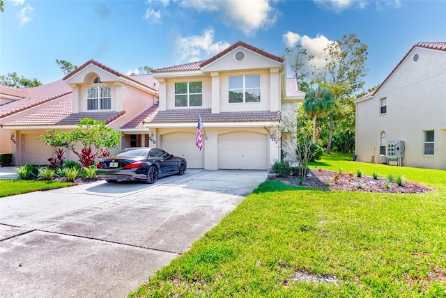 mediterranean / spanish-style home with a front yard and a garage