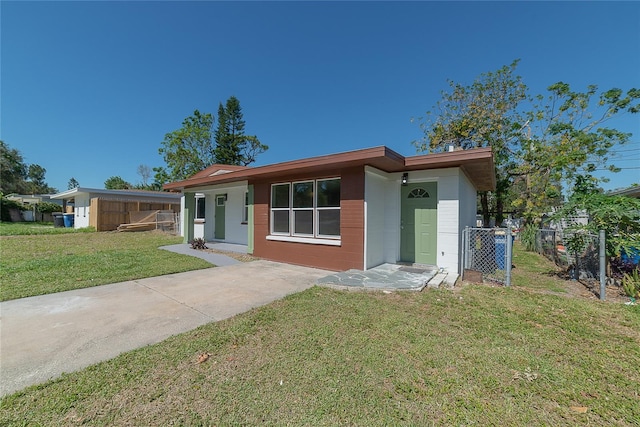 ranch-style house with a front lawn