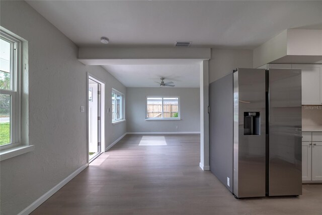 1328 Barry St, Clearwater, FL 33756 - corridor with light wood-style floors, baseboards, and beamed ceiling