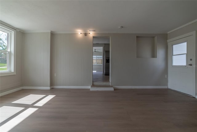 spare room with hardwood / wood-style floors