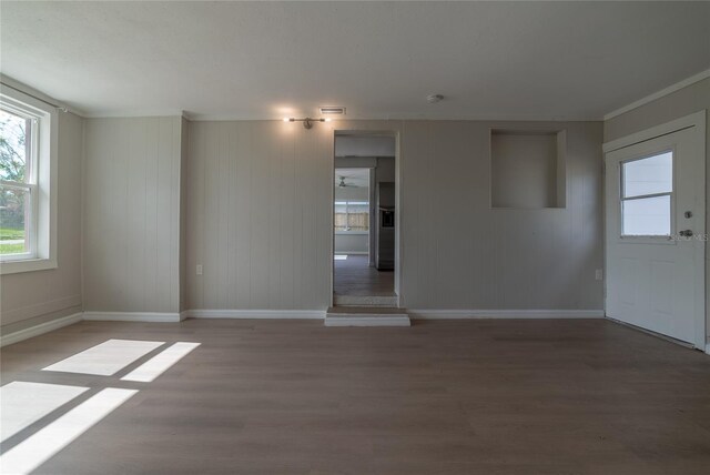 1328 Barry St, Clearwater, FL 33756 - empty room featuring plenty of natural light, baseboards, and light wood finished floors