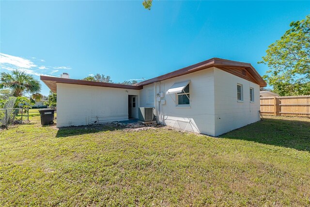 1328 Barry St, Clearwater, FL 33756 - rear view of property with central AC unit