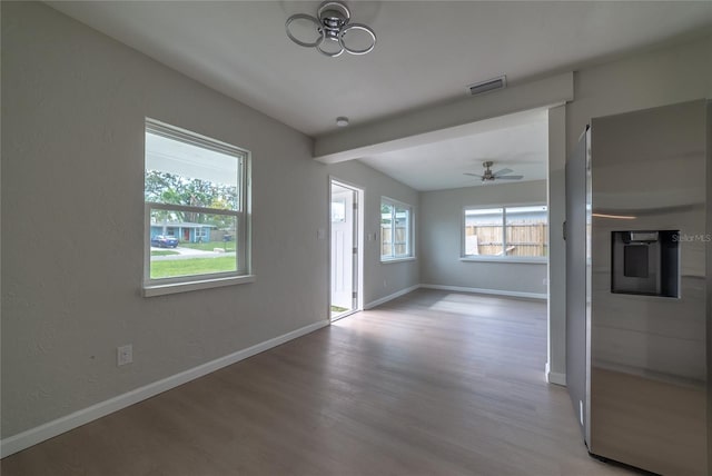 unfurnished living room with ceiling fan and light wood-type flooring