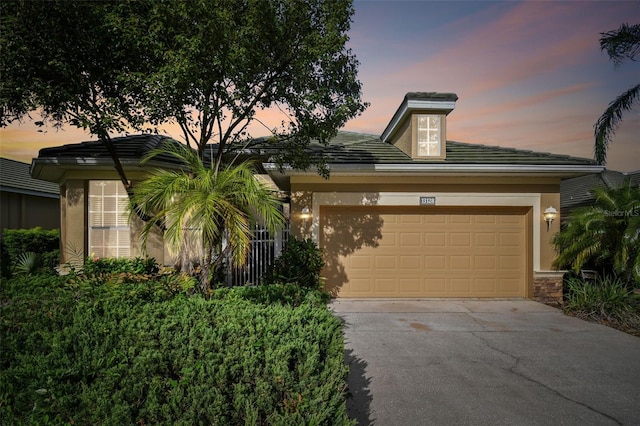 view of front of property with a garage