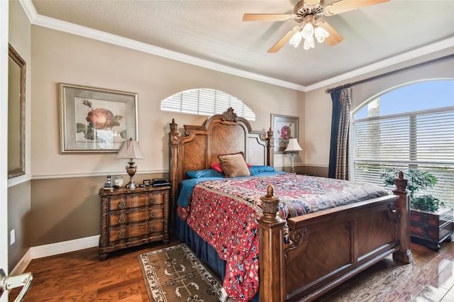 bedroom with crown molding, hardwood / wood-style flooring, and ceiling fan