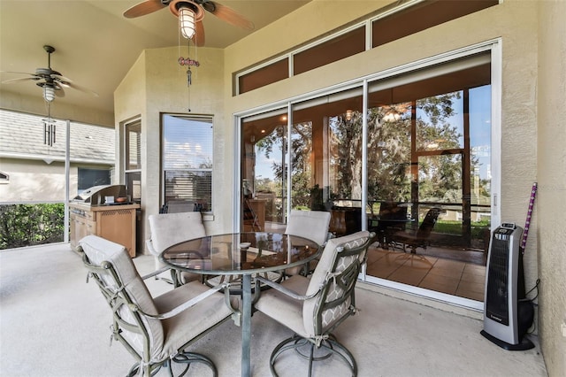 view of patio featuring area for grilling and ceiling fan