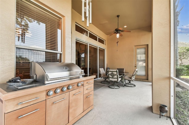 view of patio / terrace featuring an outdoor kitchen and ceiling fan