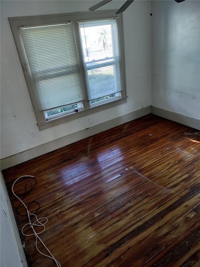 spare room with dark hardwood / wood-style flooring