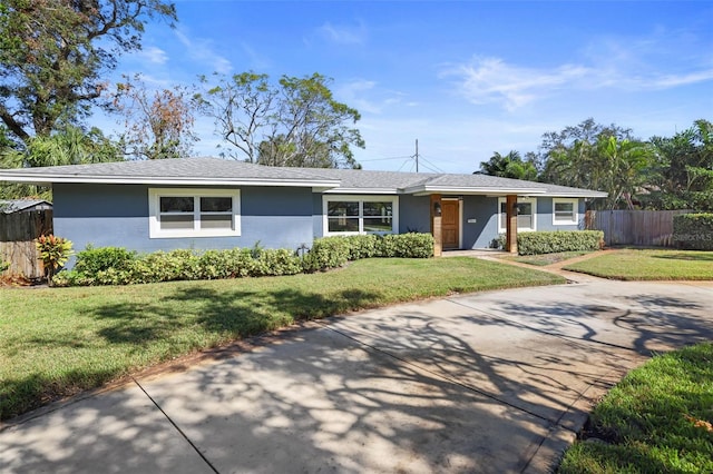 ranch-style house with a front lawn