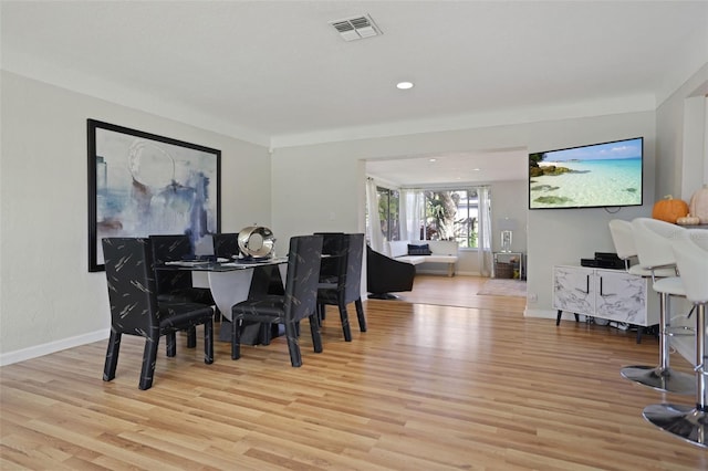 dining room with light hardwood / wood-style flooring