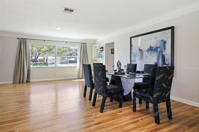 dining room with light hardwood / wood-style flooring