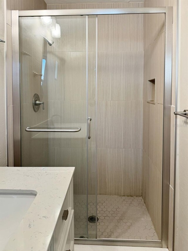 bathroom featuring vanity and walk in shower