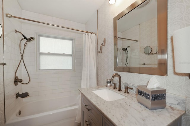 bathroom featuring vanity and shower / bath combination with curtain