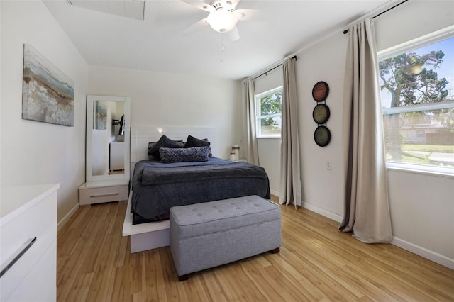 bedroom with light hardwood / wood-style floors and ceiling fan