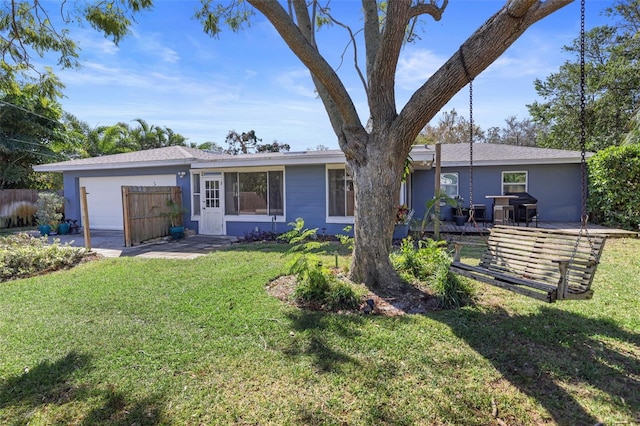 ranch-style home with a front lawn