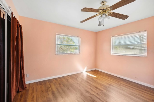 unfurnished room with ceiling fan and light hardwood / wood-style floors