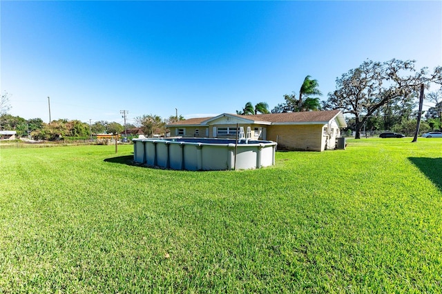 view of yard featuring central AC unit