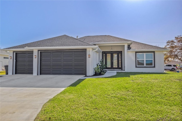 view of front of property featuring french doors, a front lawn, and a garage