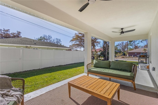 sunroom / solarium with ceiling fan