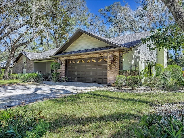 single story home featuring a garage and a front yard